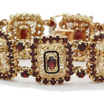 18k yellow gold and garnet lady filagree design bracelet